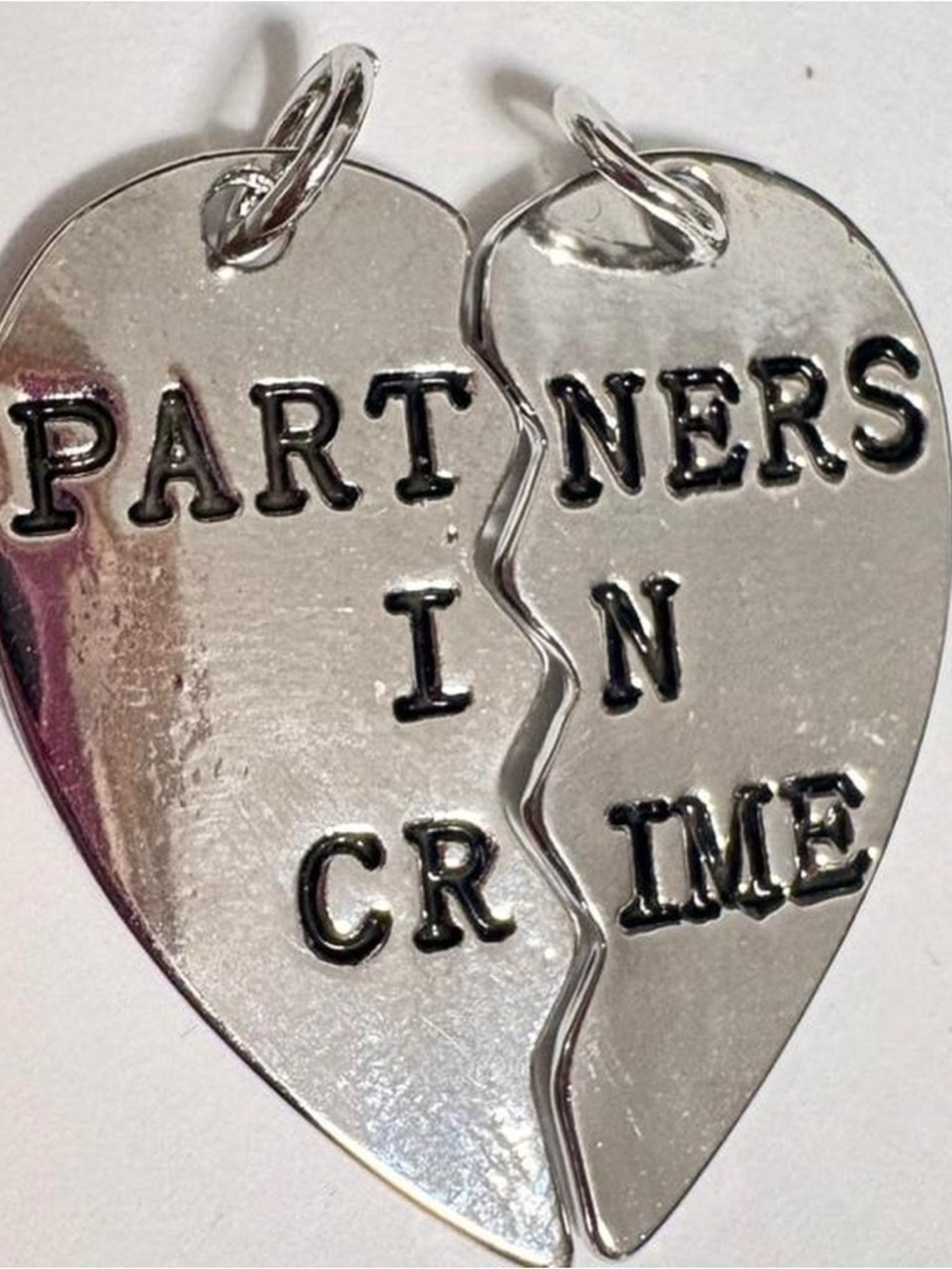 Silver tone 'Partners in Crime' Split Heart Necklace Pendant